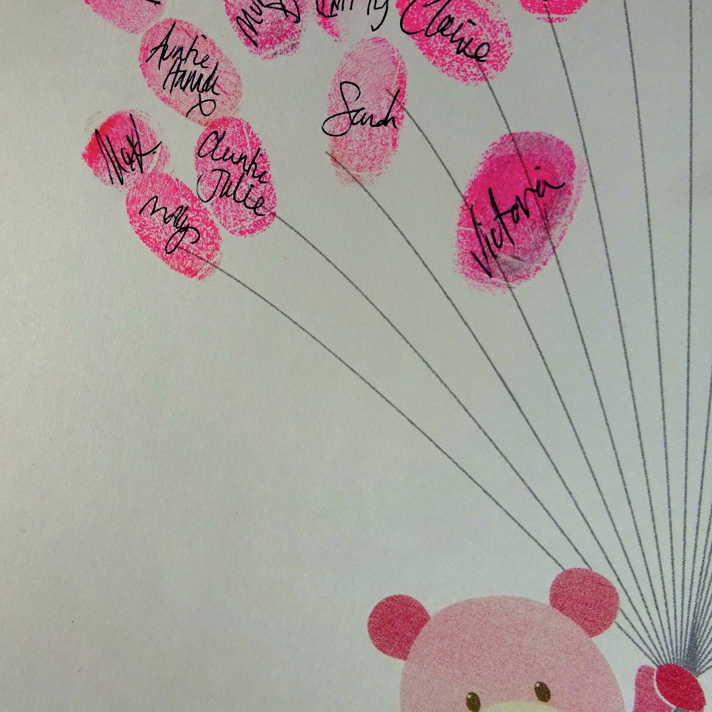 Fingerprint art, pink teddy holds fingerprint balloons