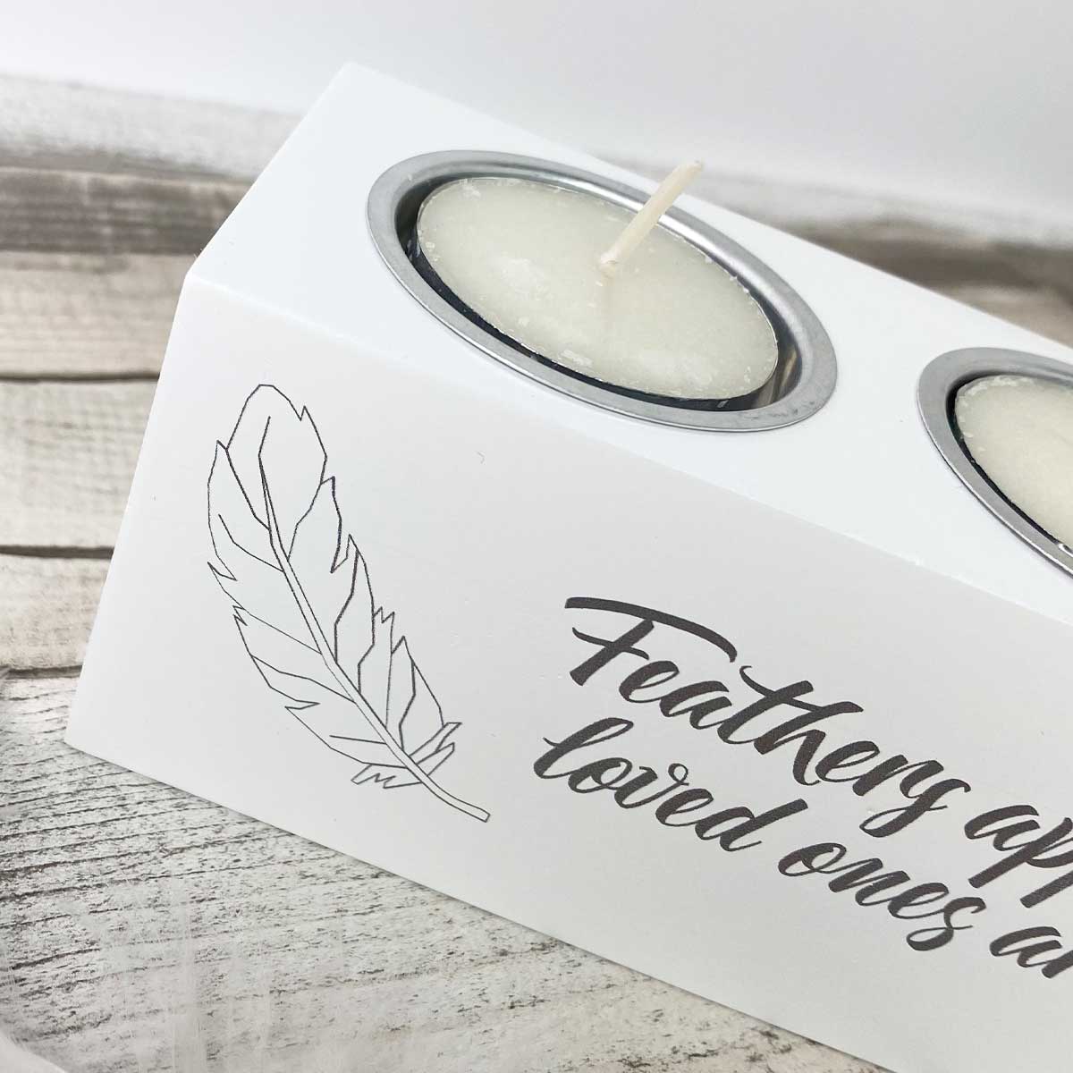 'Feathers Appear' white wooden triple tea light holder